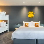 Orangutan With Bathpod room with a main bed and bunk bed at Blu Monkey Hub & Hotel Krabi Town